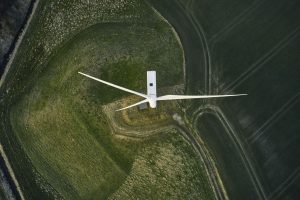Night scene with wind mills. Wind turbines generating renewable energy. Aerial shot